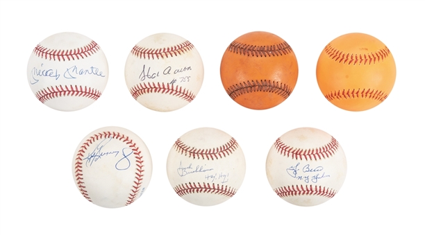 Lot of (7) Baseballs, Including (5) Hall of Famer Single Signed Baseballs (Aaron, Berra, Brickhouse,Griffey Jr & Mantle) Plus (2) Unsigned Charles O. Finley Orange Baseballs (Beckett PreCert)